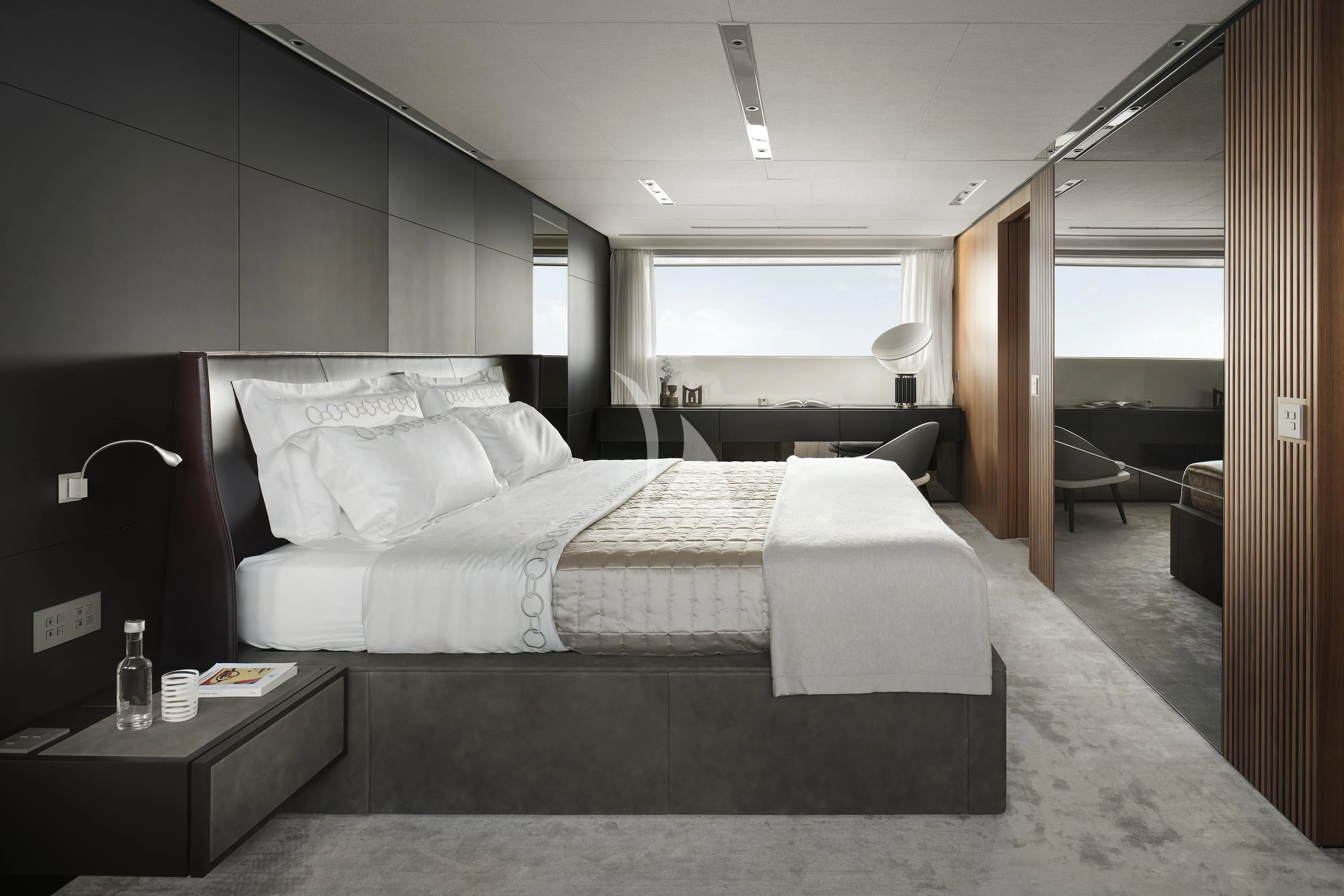 a room with a bed and a table aboard AIX Yacht for Sale