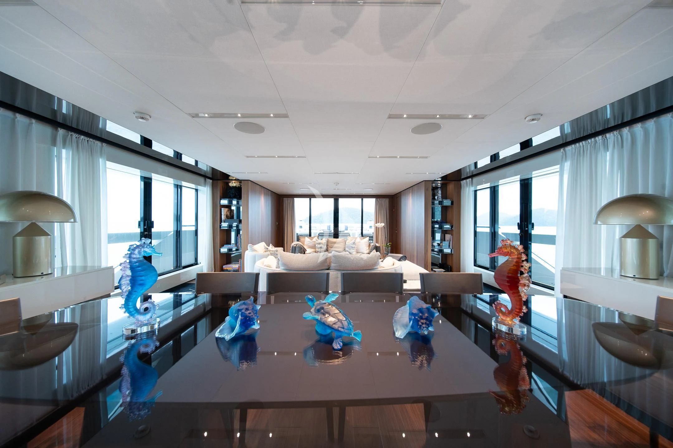 a room with a table and chairs aboard AIX Yacht for Sale