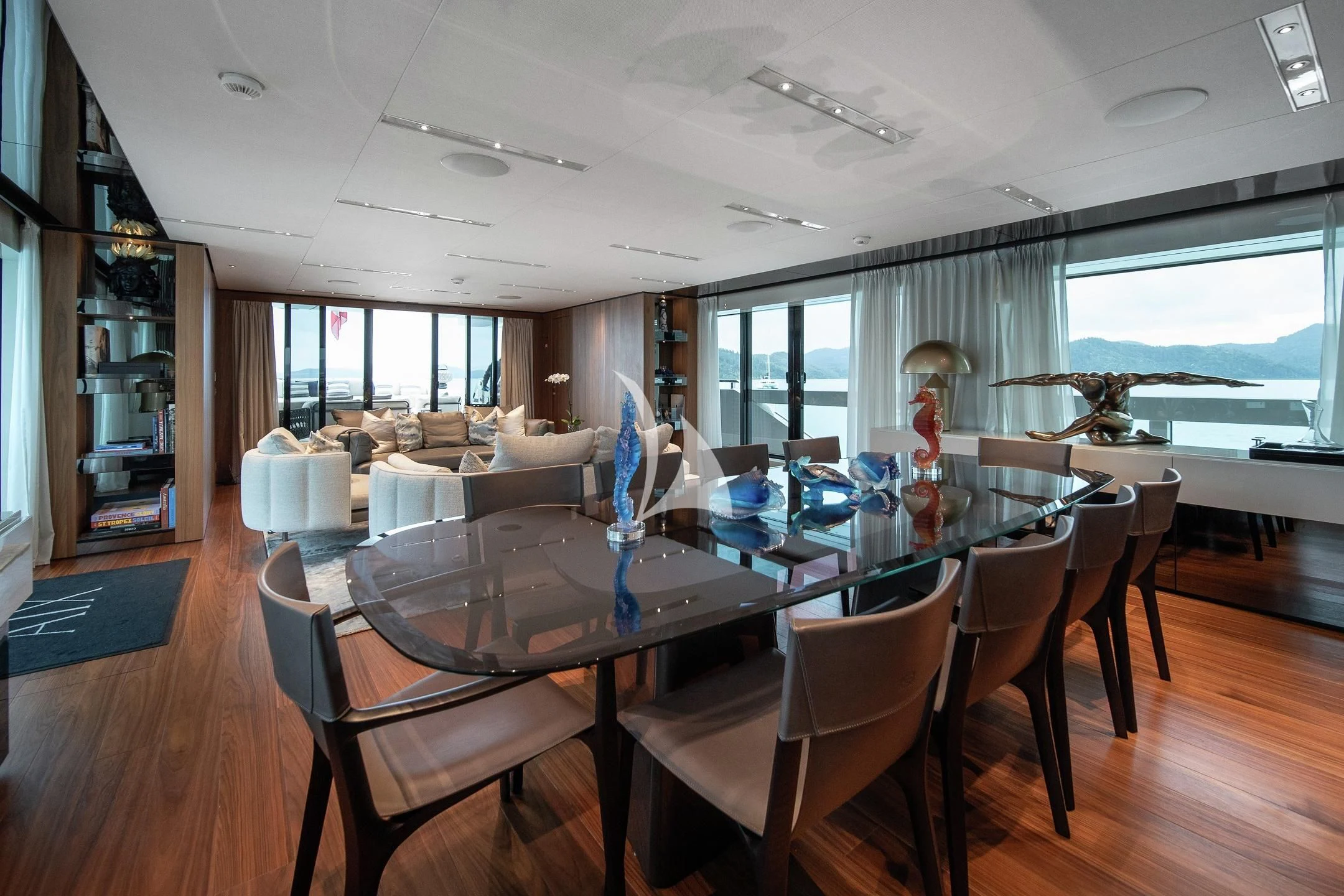 a dining room with a large table and chairs aboard AIX Yacht for Sale