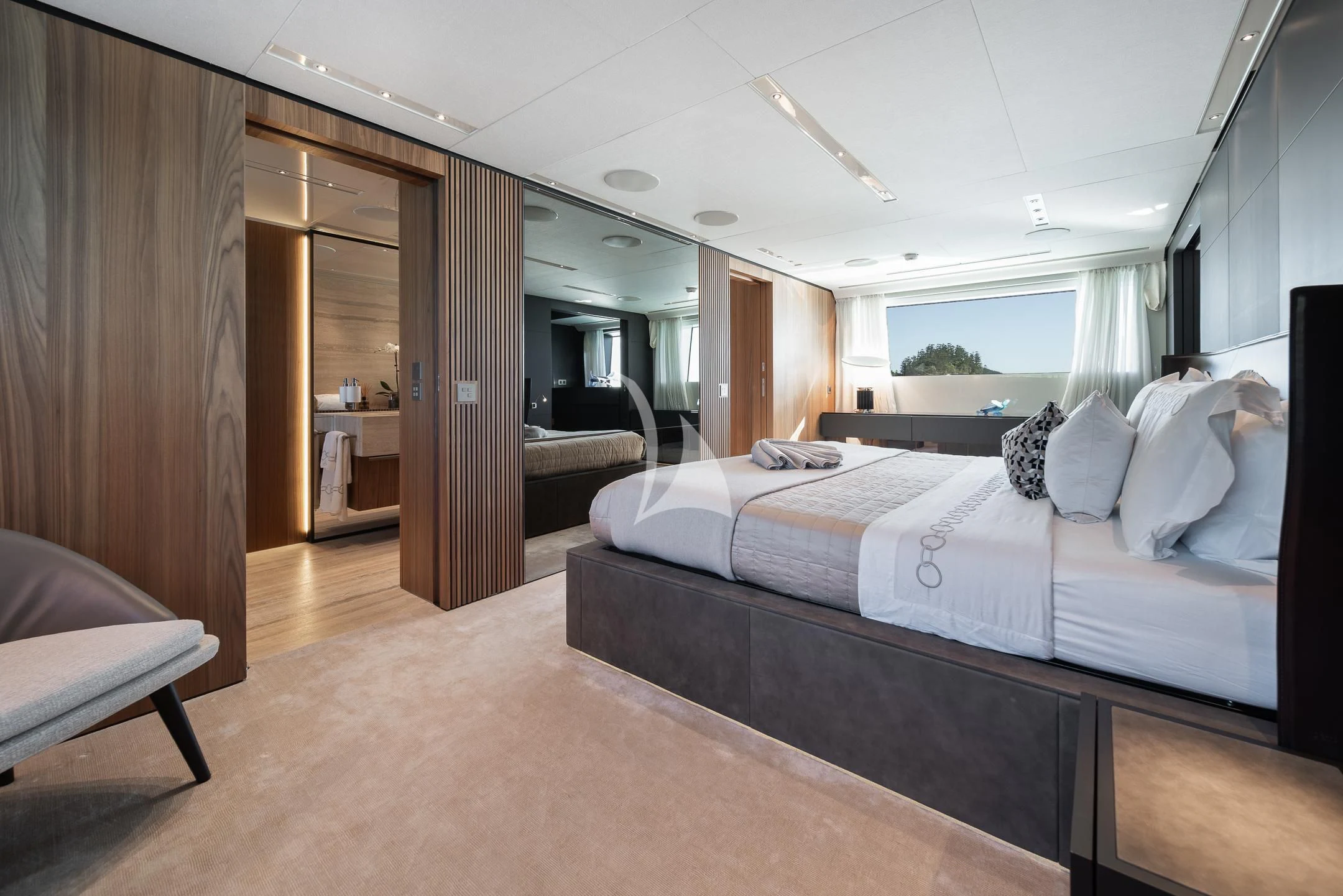 a room with a bed and a door aboard AIX Yacht for Sale