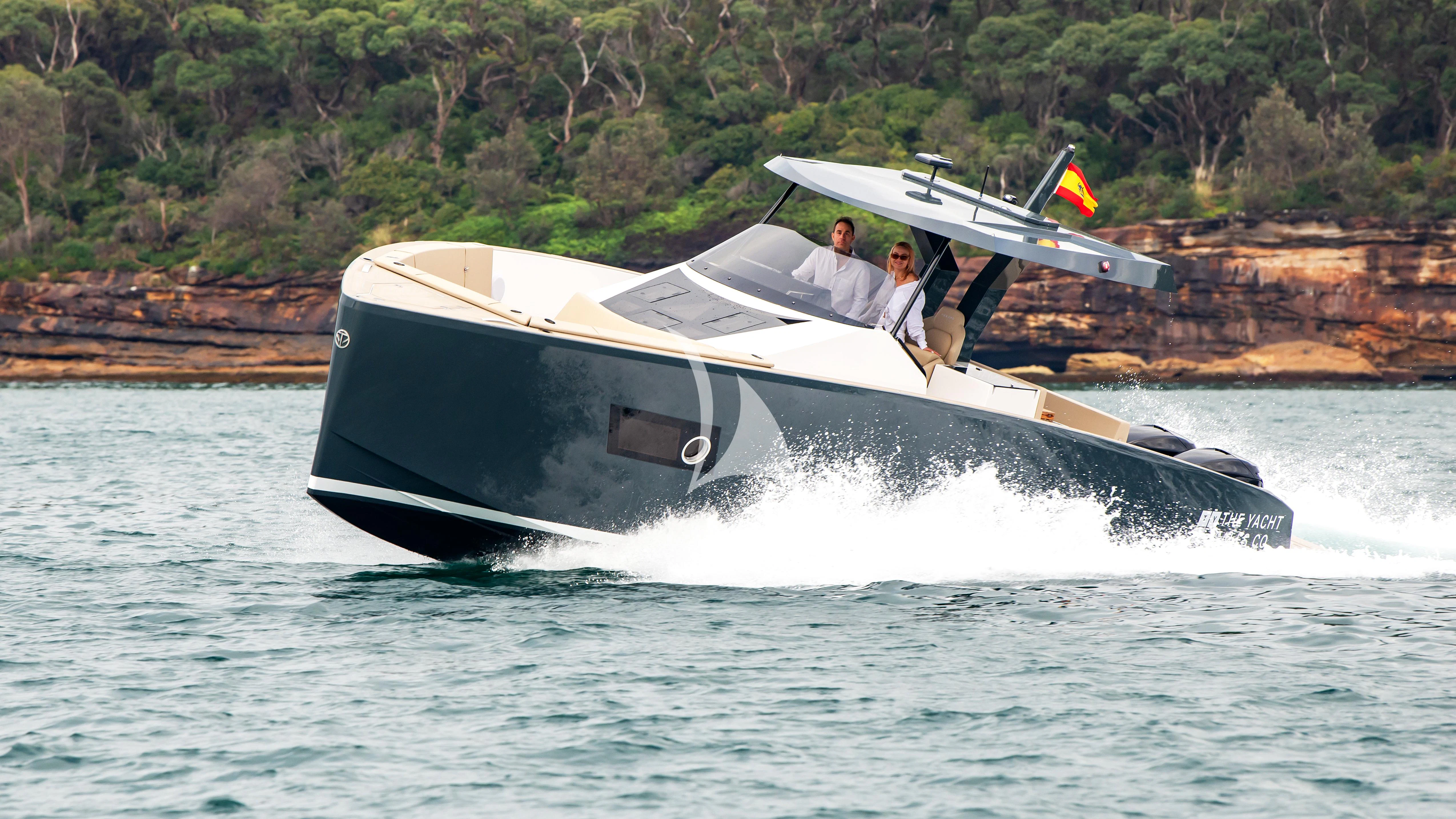 a couple of men in a speedboat on water aboard AIX Yacht for Sale
