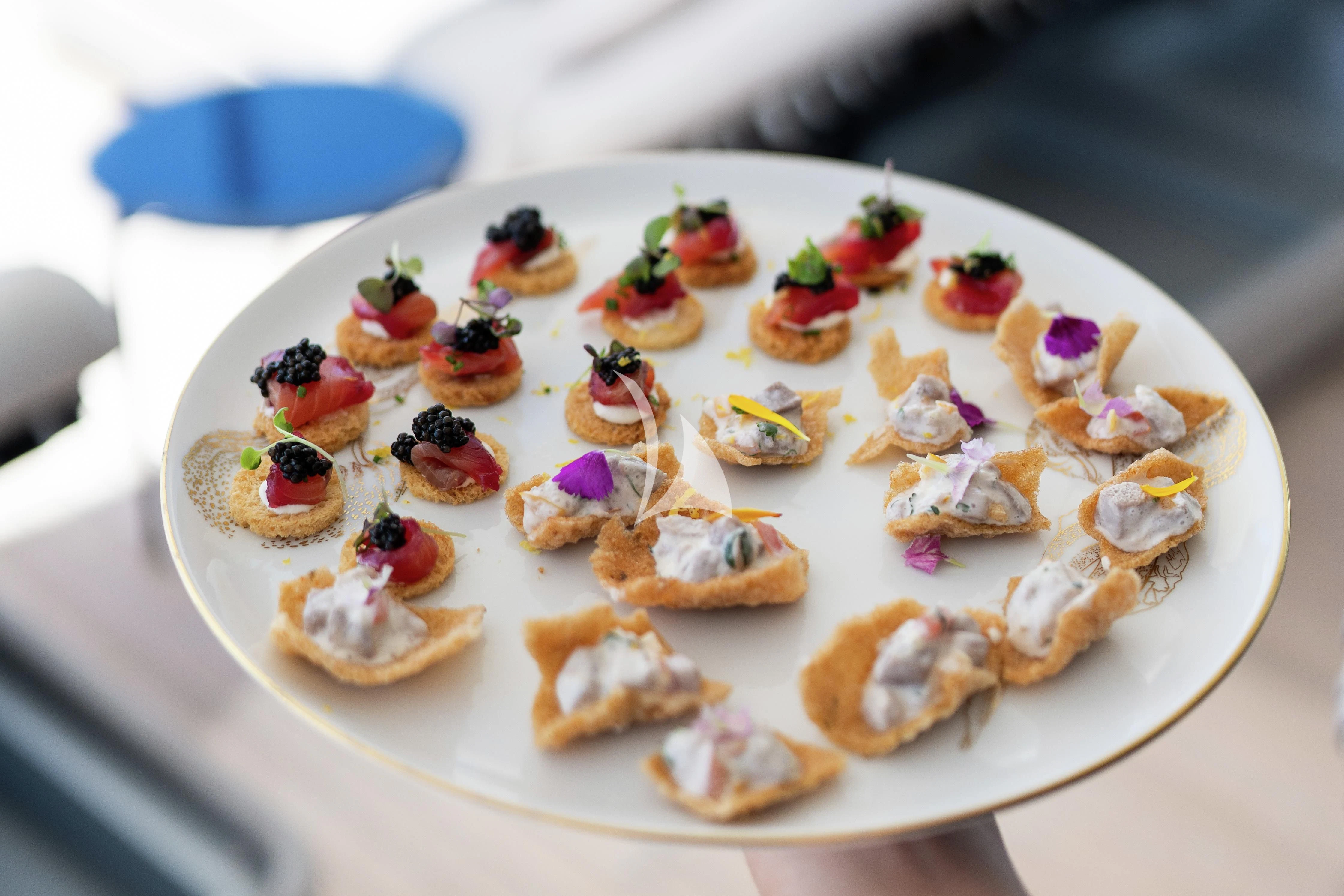 a plate of desserts aboard AIX Yacht for Sale
