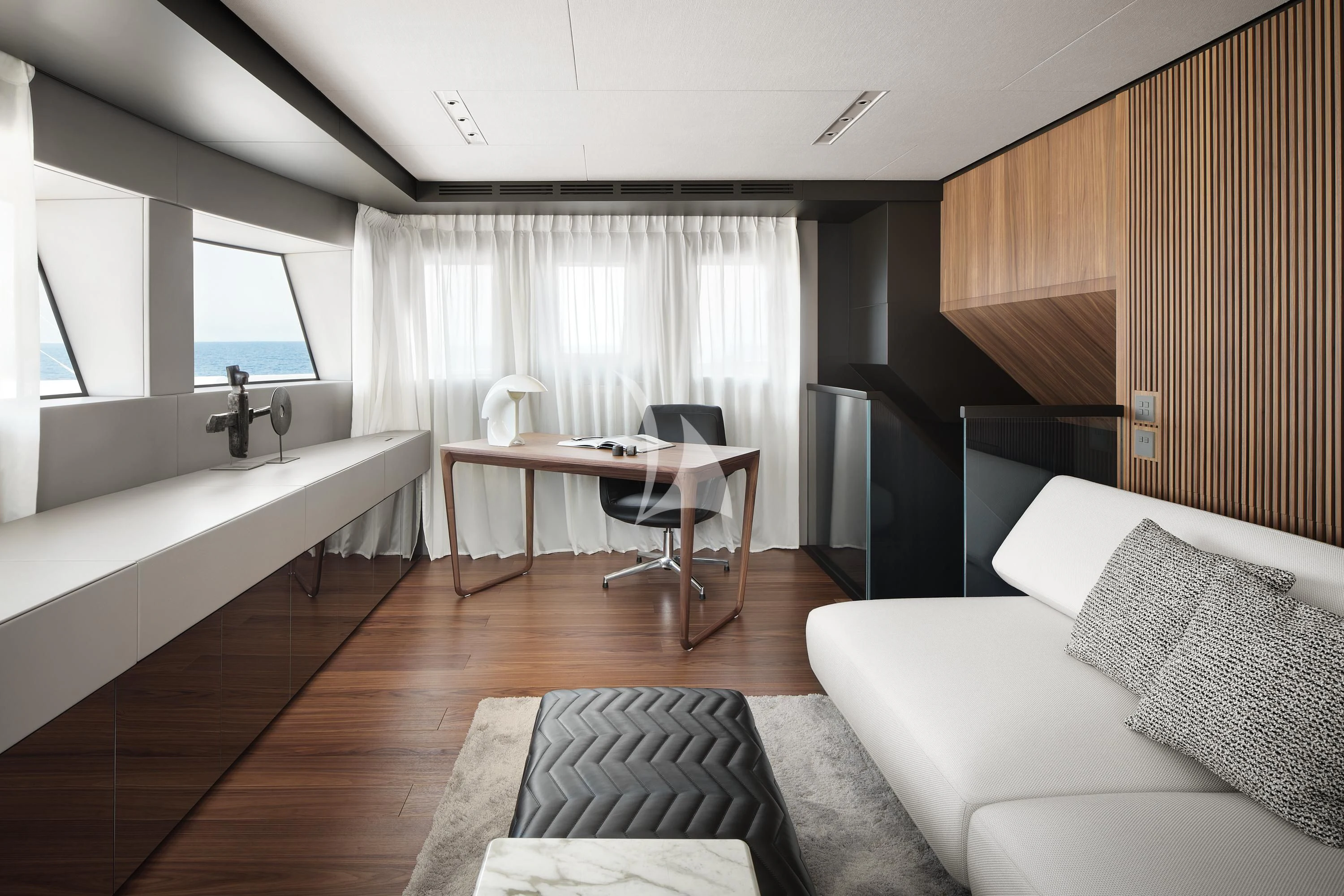 a room with a couch and a table aboard AIX Yacht for Sale