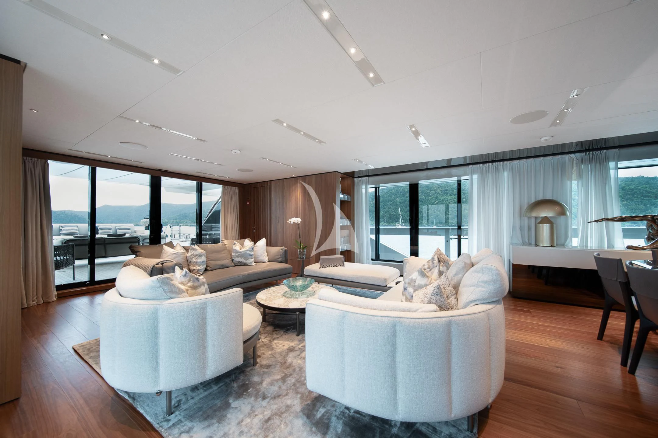 a living room with a large window aboard AIX Yacht for Sale
