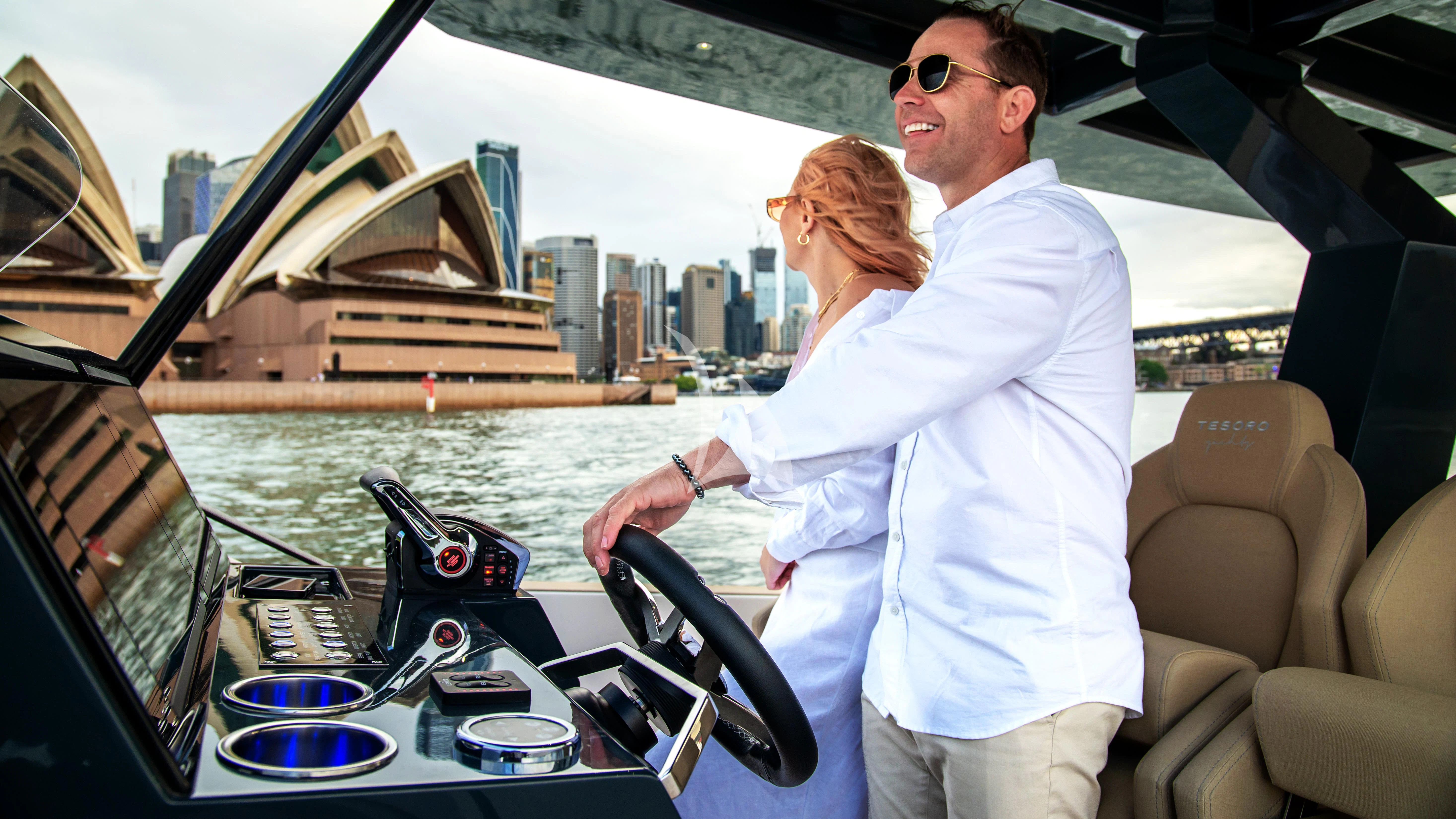a man and woman on a boat aboard AIX Yacht for Sale