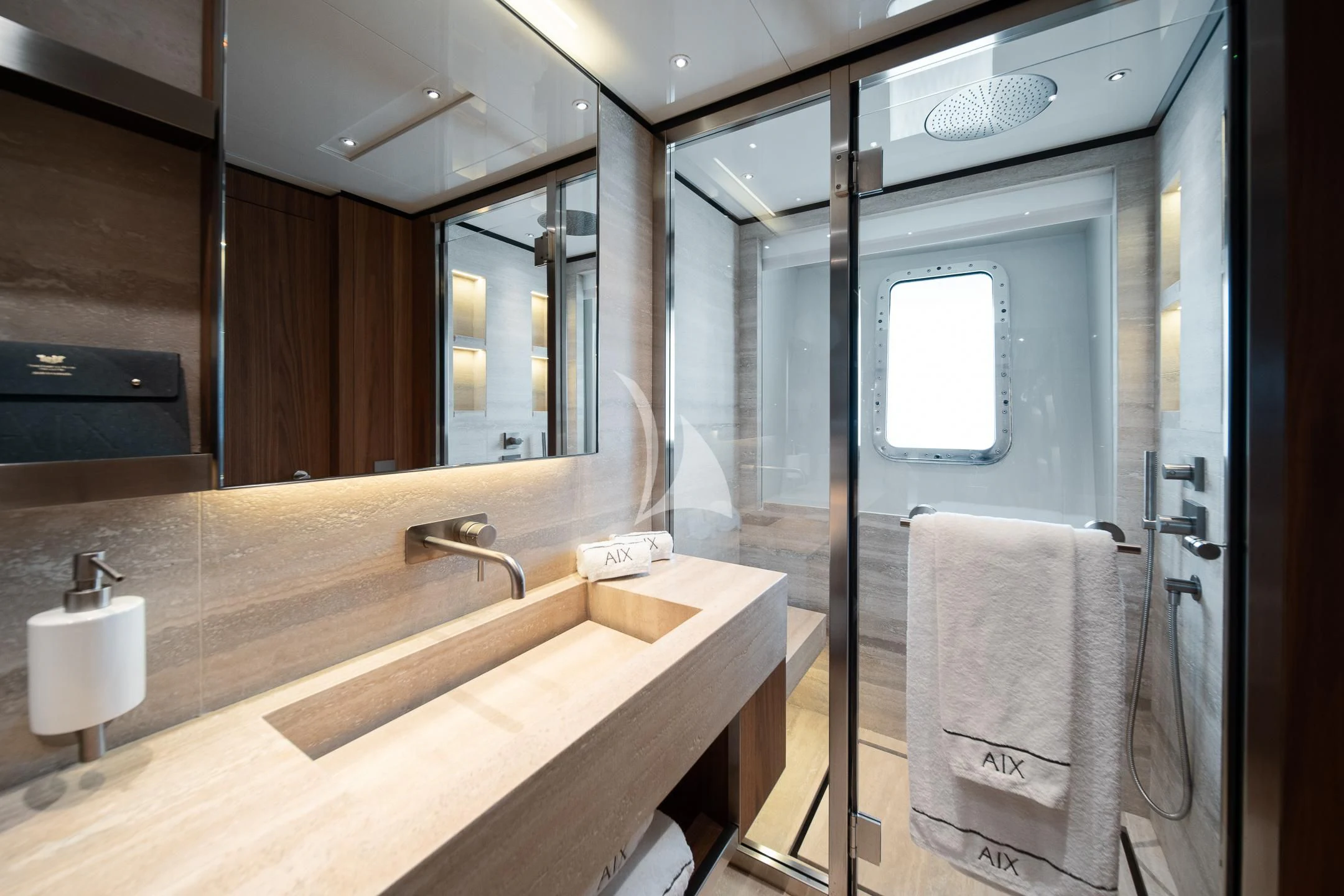 a bathroom with a sink and a mirror aboard AIX Yacht for Sale