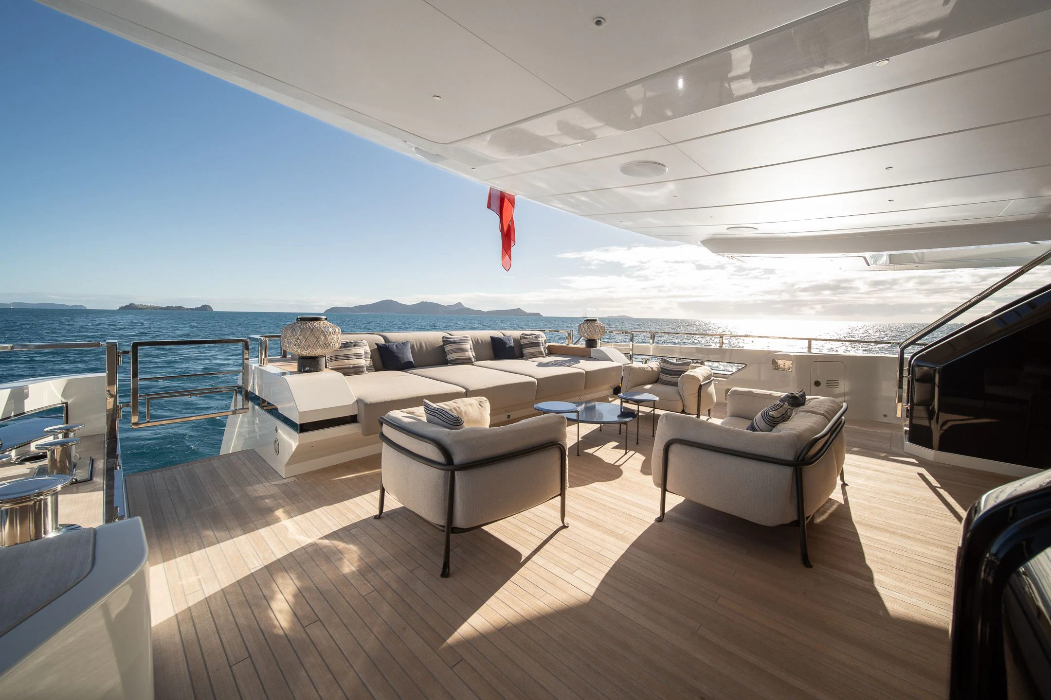 a large living room with a large balcony overlooking the ocean aboard AIX Yacht for Sale