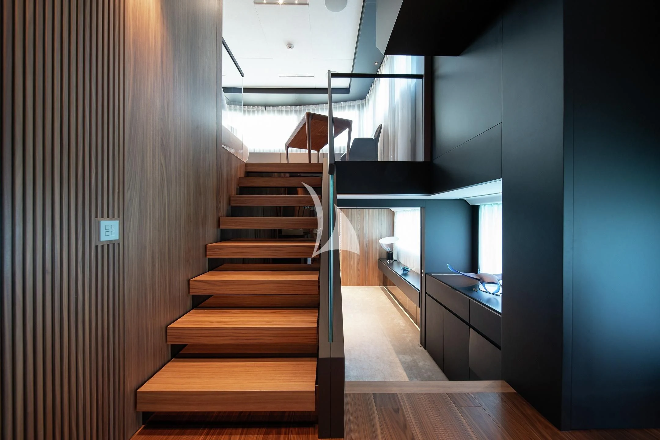a wooden staircase in a house aboard AIX Yacht for Sale