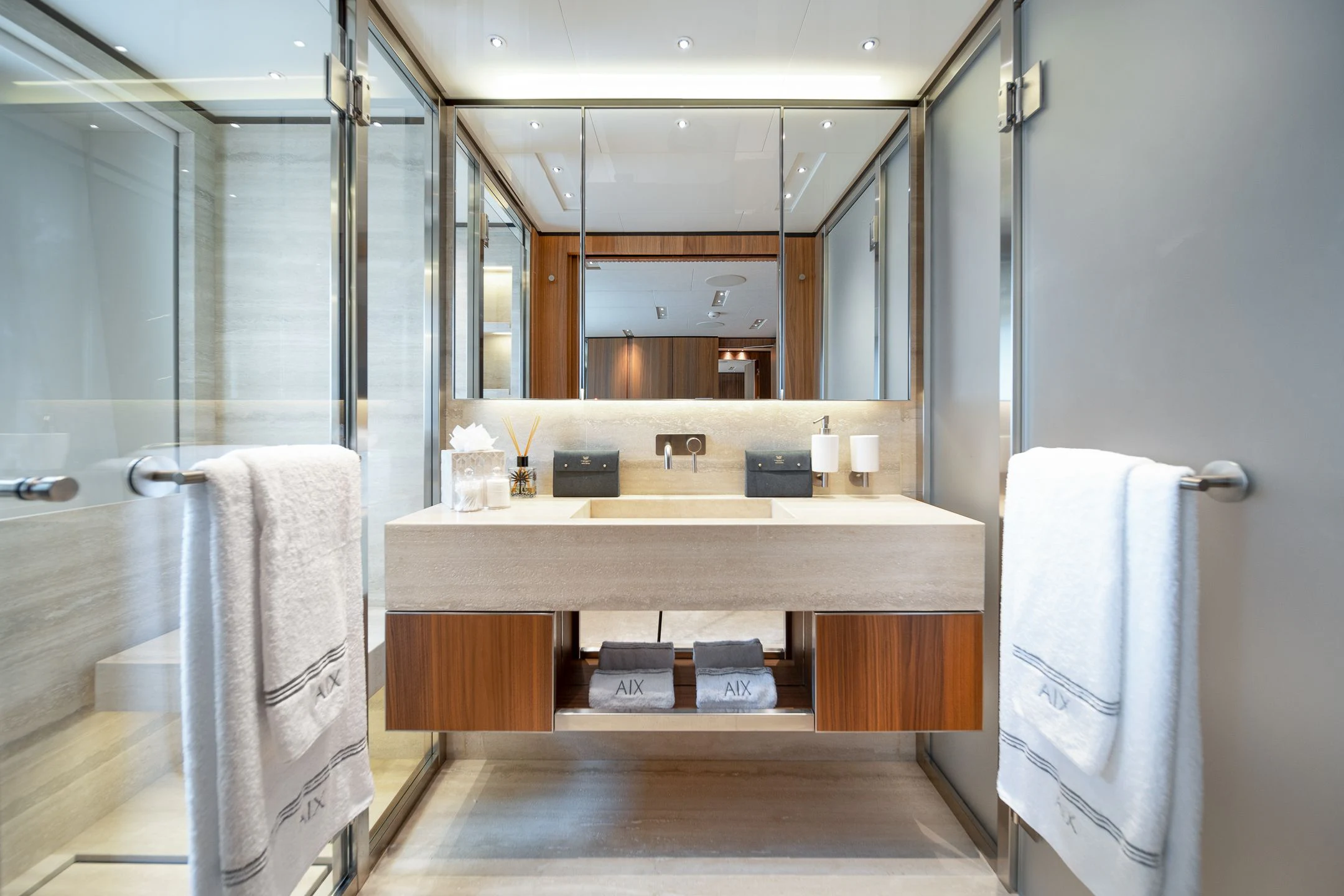 a bathroom with a large mirror aboard AIX Yacht for Sale