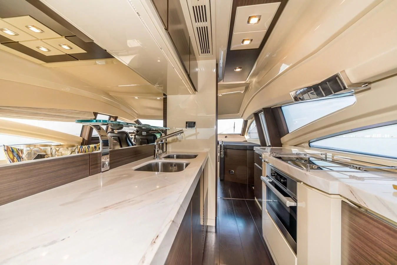 a kitchen with a large island aboard AZIMUT 85 Yacht for Sale
