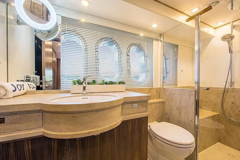 a bathroom with a sink and a toilet aboard JOY Yacht for Sale