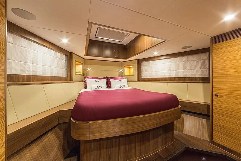 a bed in a room aboard JOY Yacht for Sale