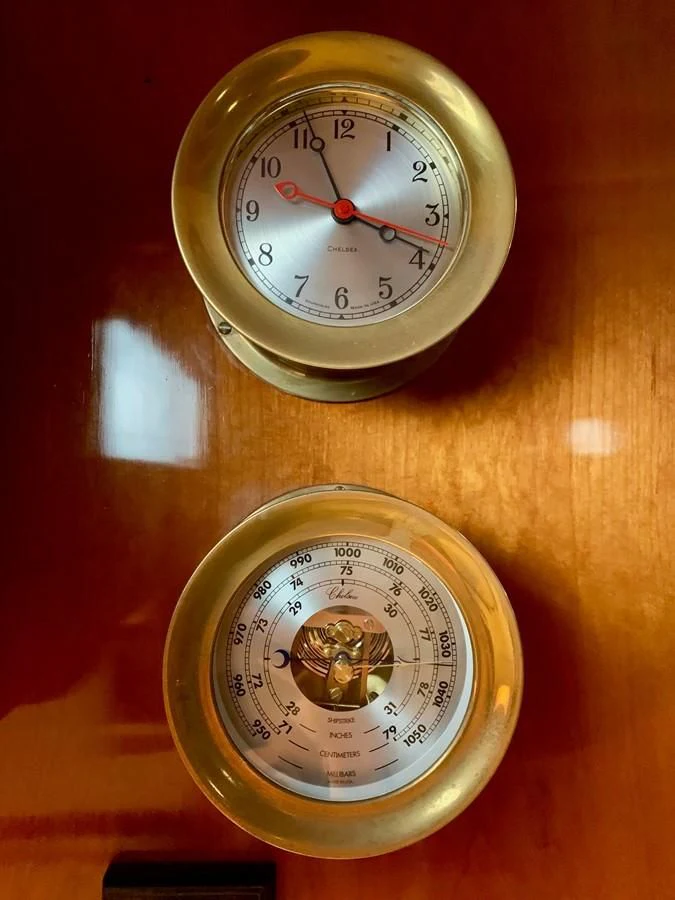 a couple of clocks on a table aboard WILD HORSES Yacht for Sale