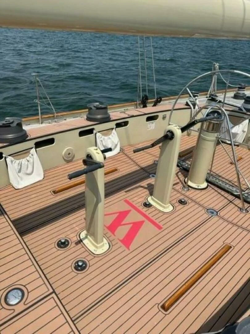 a wooden boat on a deck aboard WILD HORSES Yacht for Sale