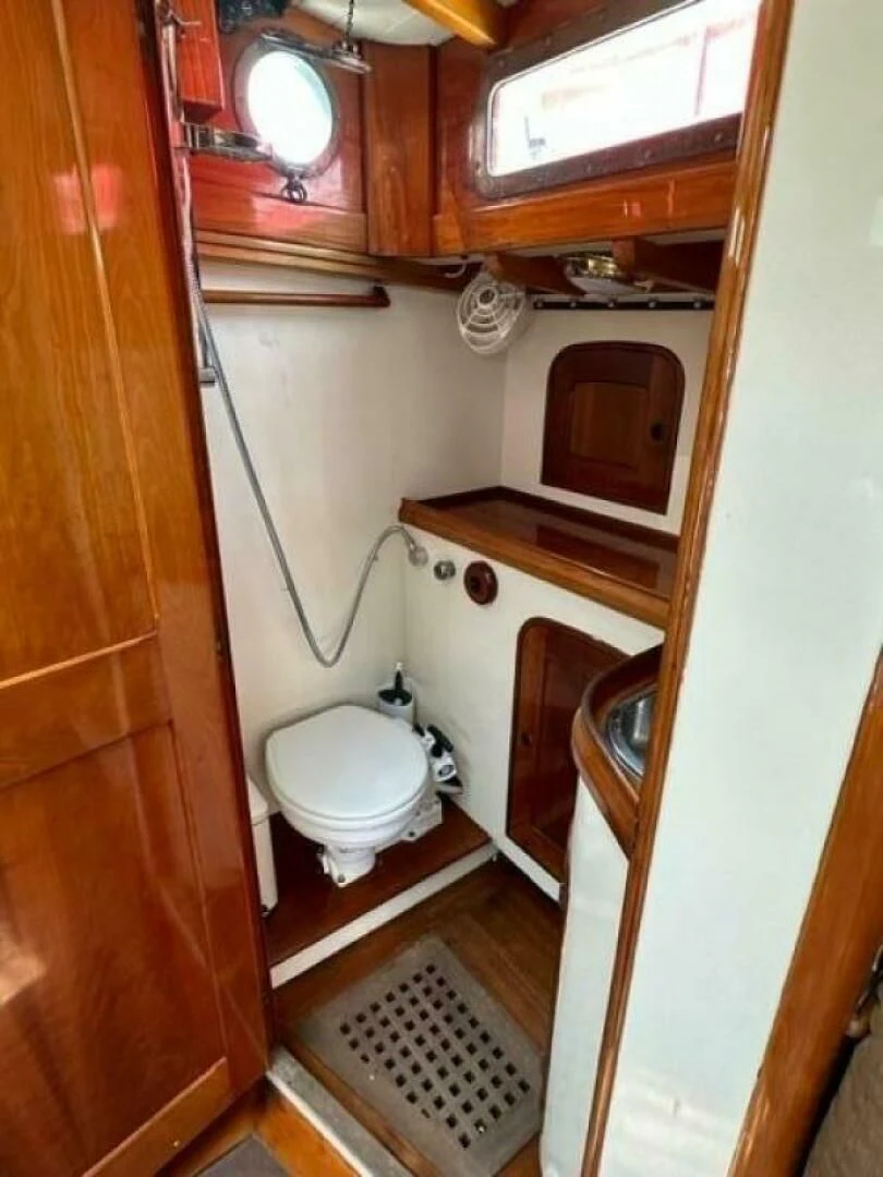 a small bathroom with a toilet aboard WILD HORSES Yacht for Sale