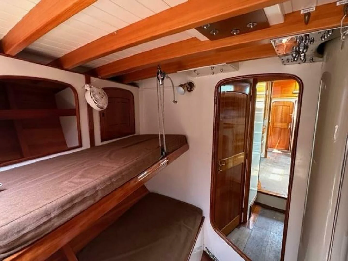 a room with a bed and a desk aboard WILD HORSES Yacht for Sale