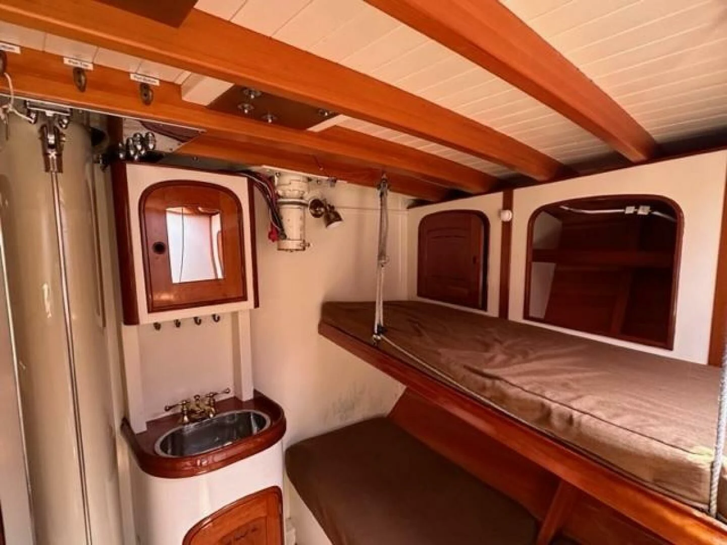 a bathroom with a wood ceiling aboard WILD HORSES Yacht for Sale