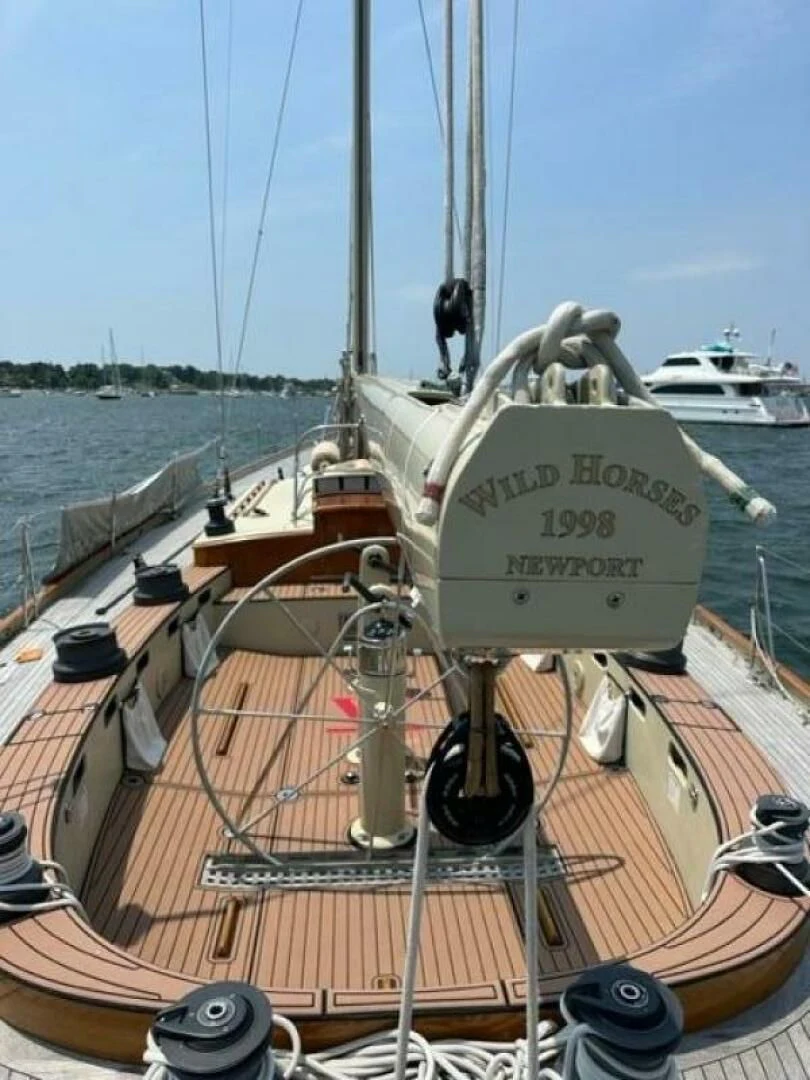 a boat with a large sail aboard WILD HORSES Yacht for Sale