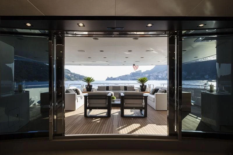 a room with a table and chairs aboard UNICORN Yacht for Sale