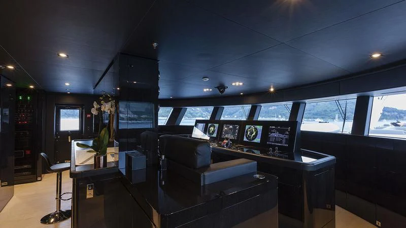 a room with a couch and a tv aboard UNICORN Yacht for Sale