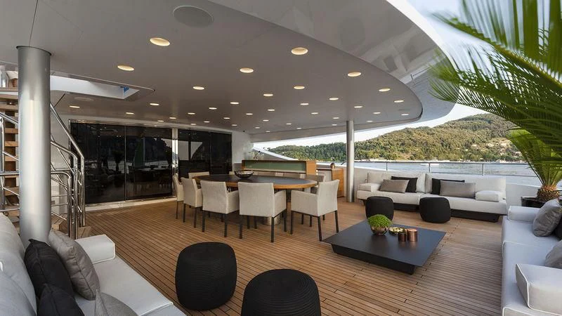a large living room with a large open roof aboard UNICORN Yacht for Sale
