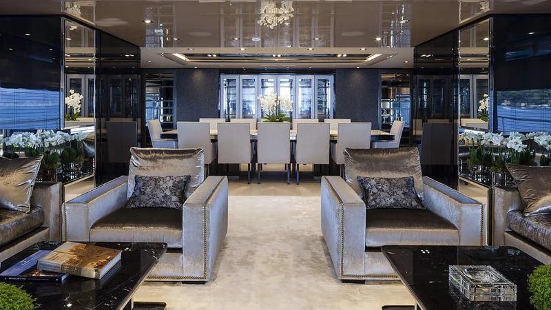 a room with a couch and a table aboard UNICORN Yacht for Sale