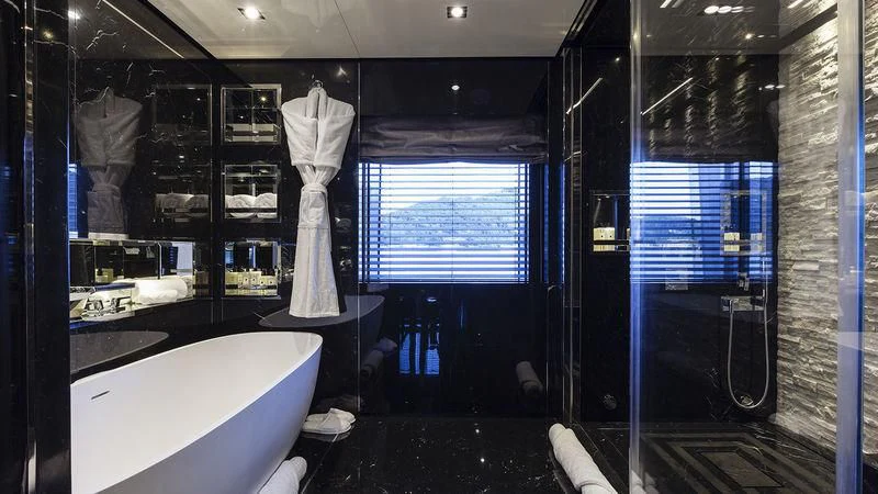 a large room with a large white bathtub and a large white vase with a white dress aboard UNICORN Yacht for Sale