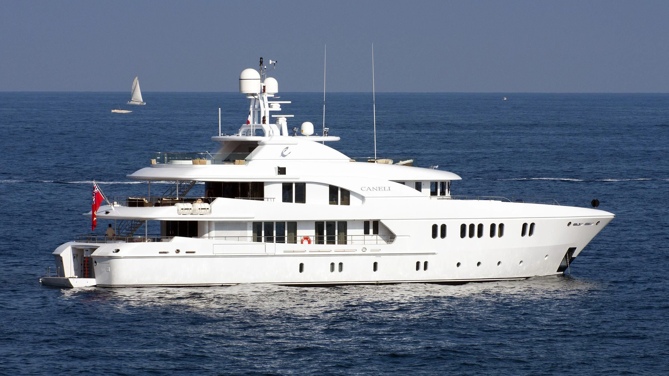 a large white boat in the water aboard BACA Yacht for Charter