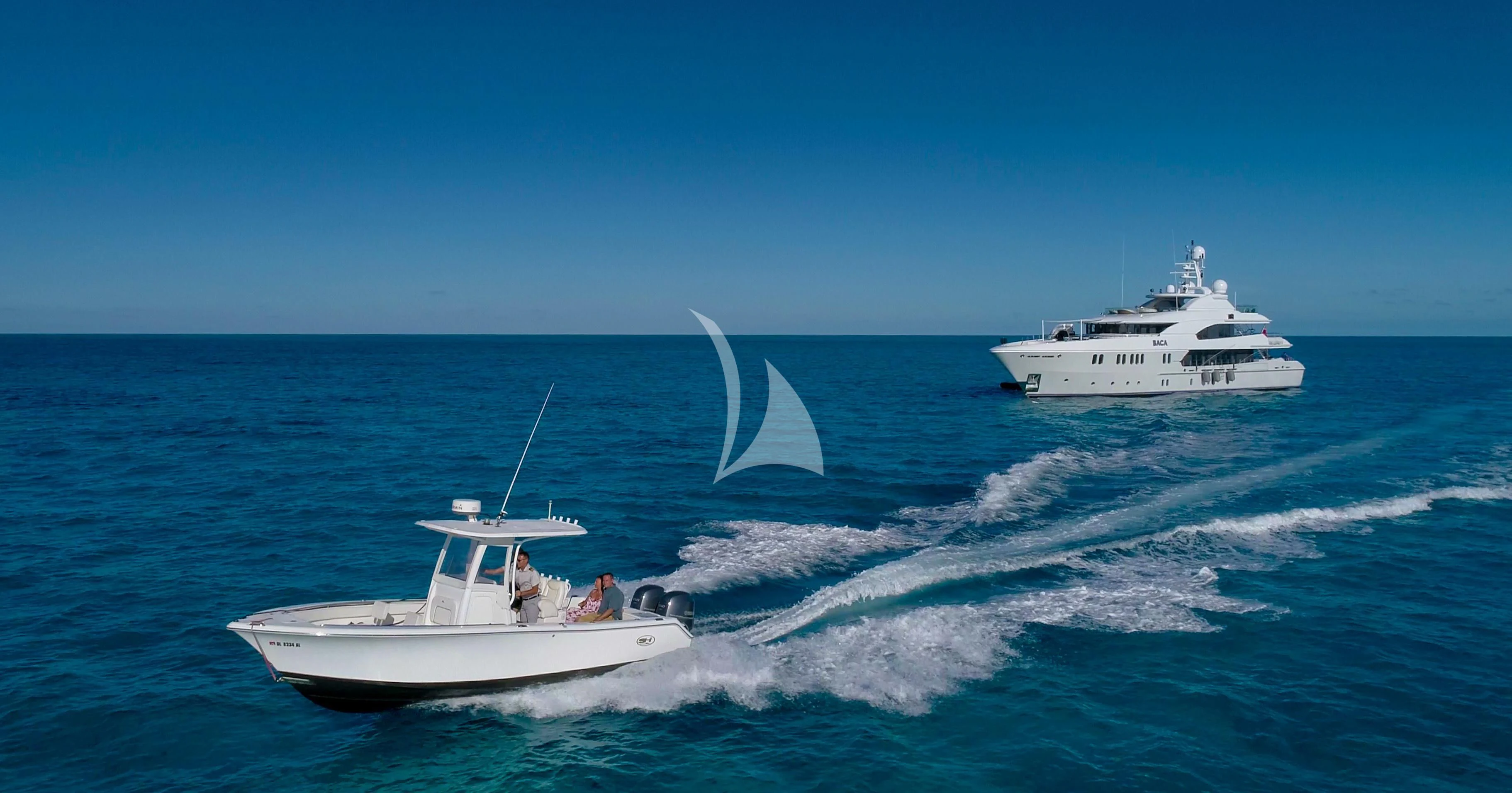 a couple of white boats on the water aboard BACA Yacht for Charter