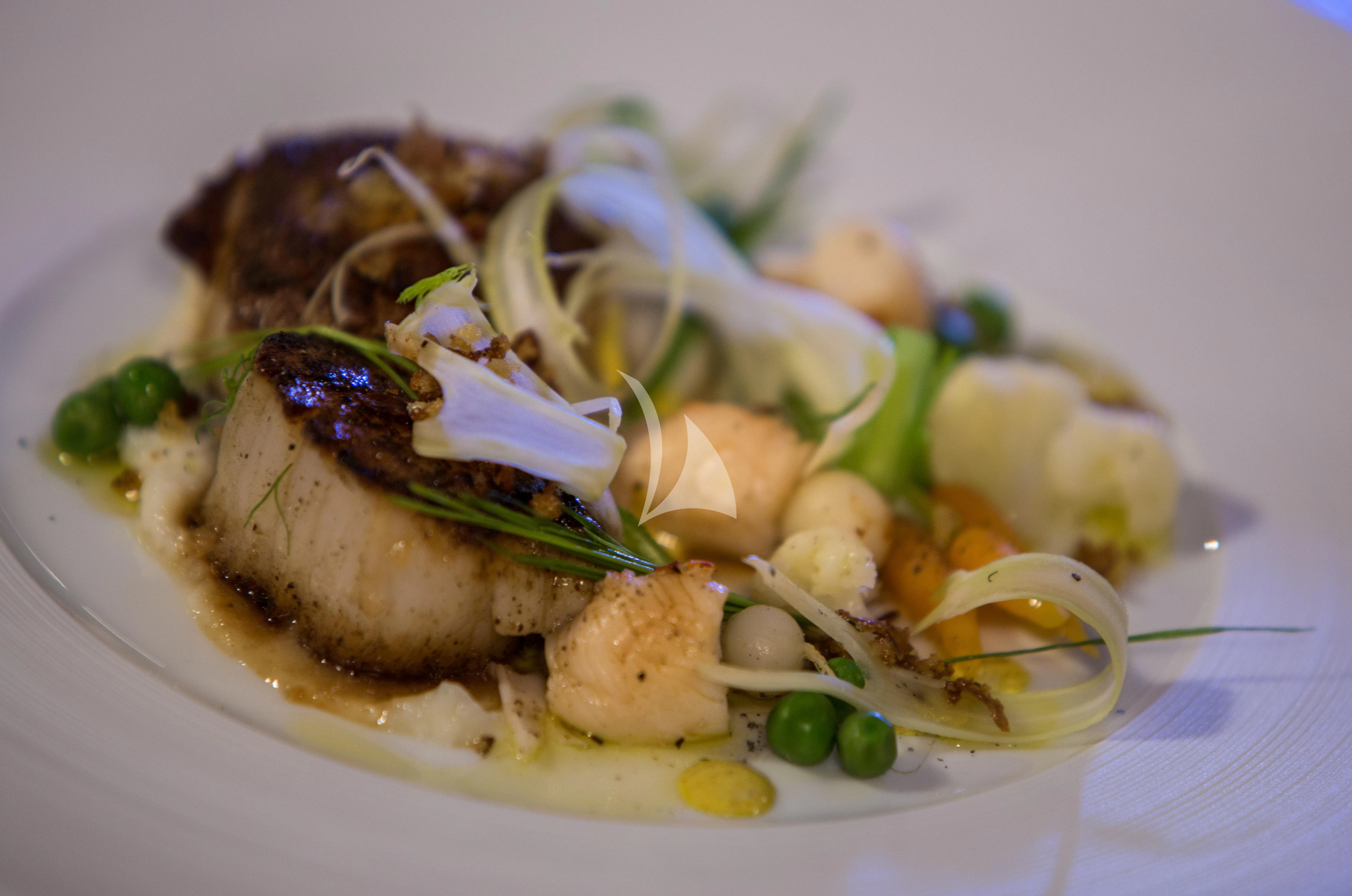 a plate of food aboard BACA Yacht for Charter