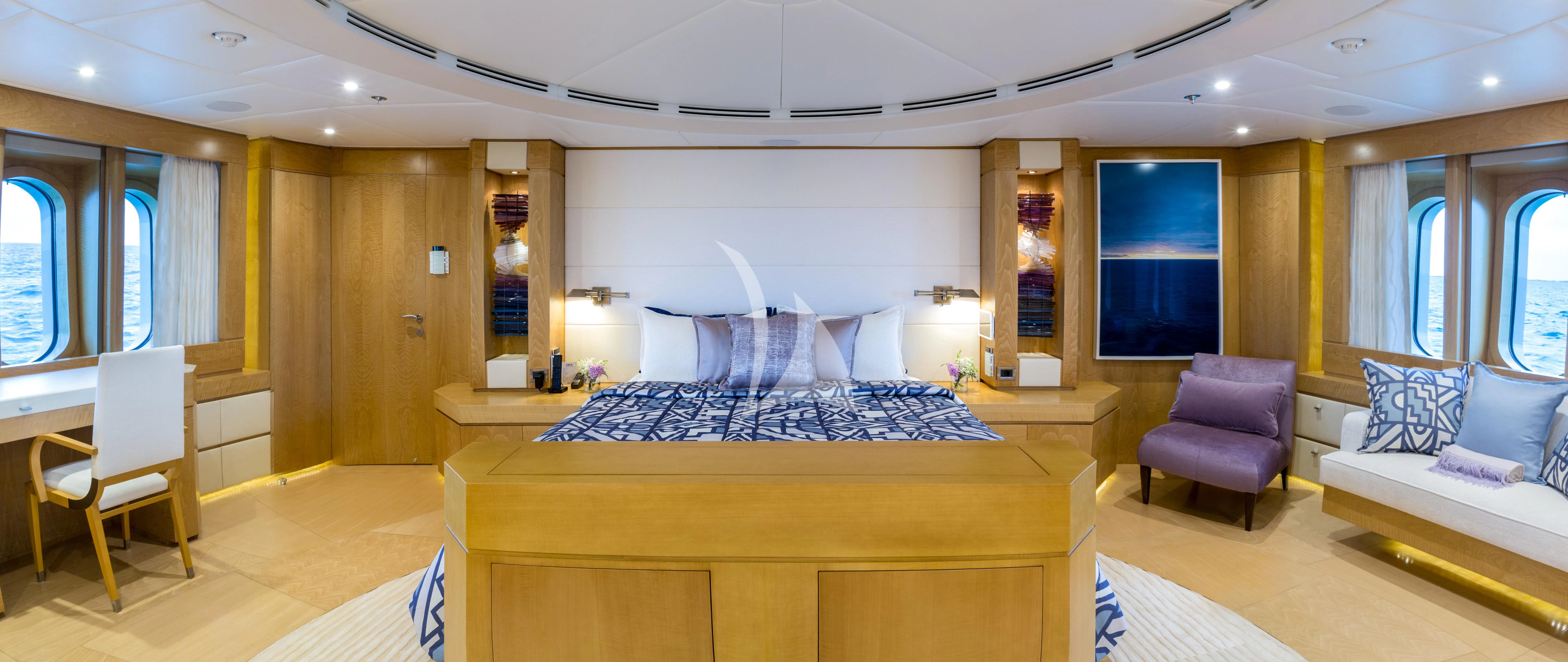 a room with a bed and a couch aboard BACA Yacht for Charter