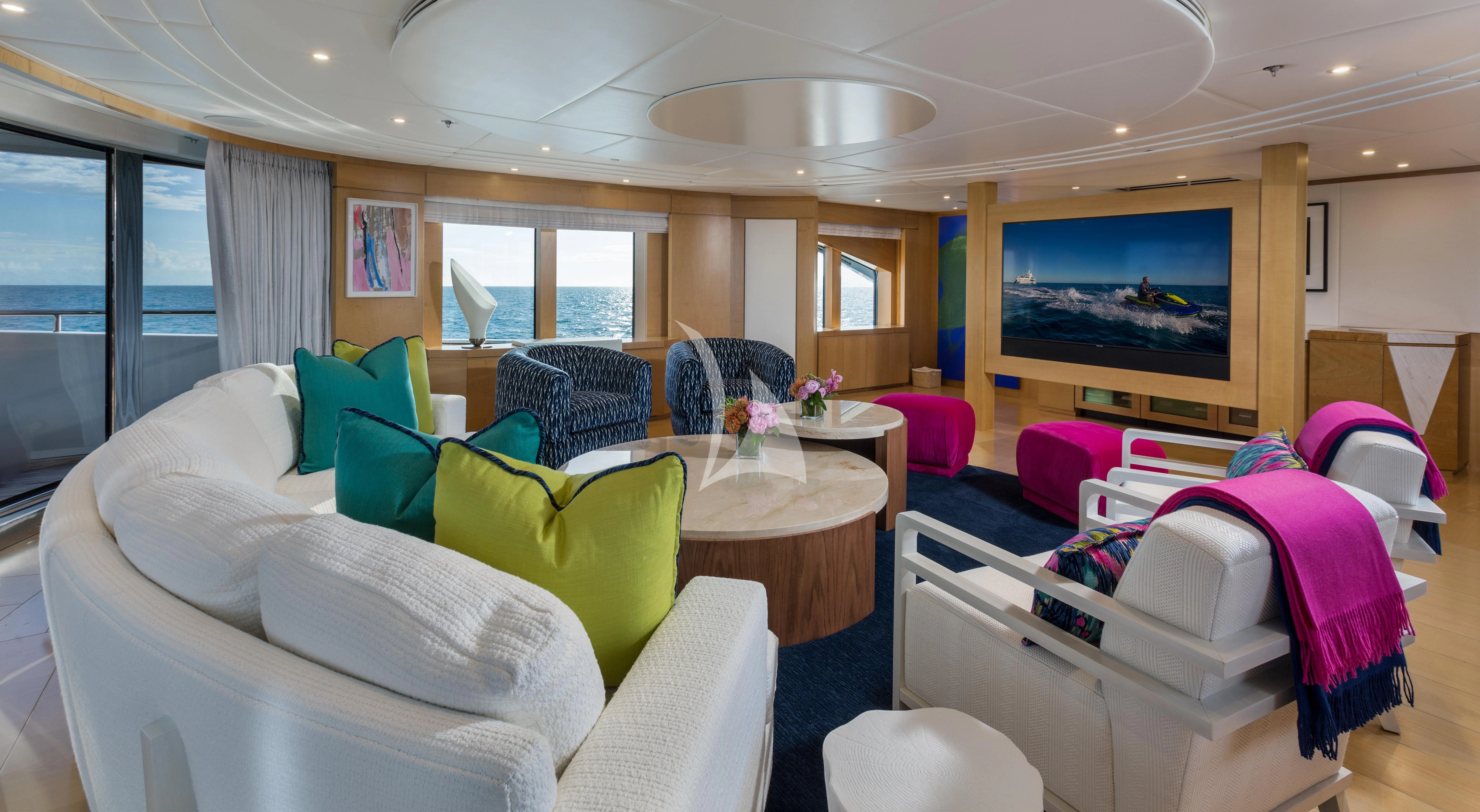 a living room with a large television aboard BACA Yacht for Charter