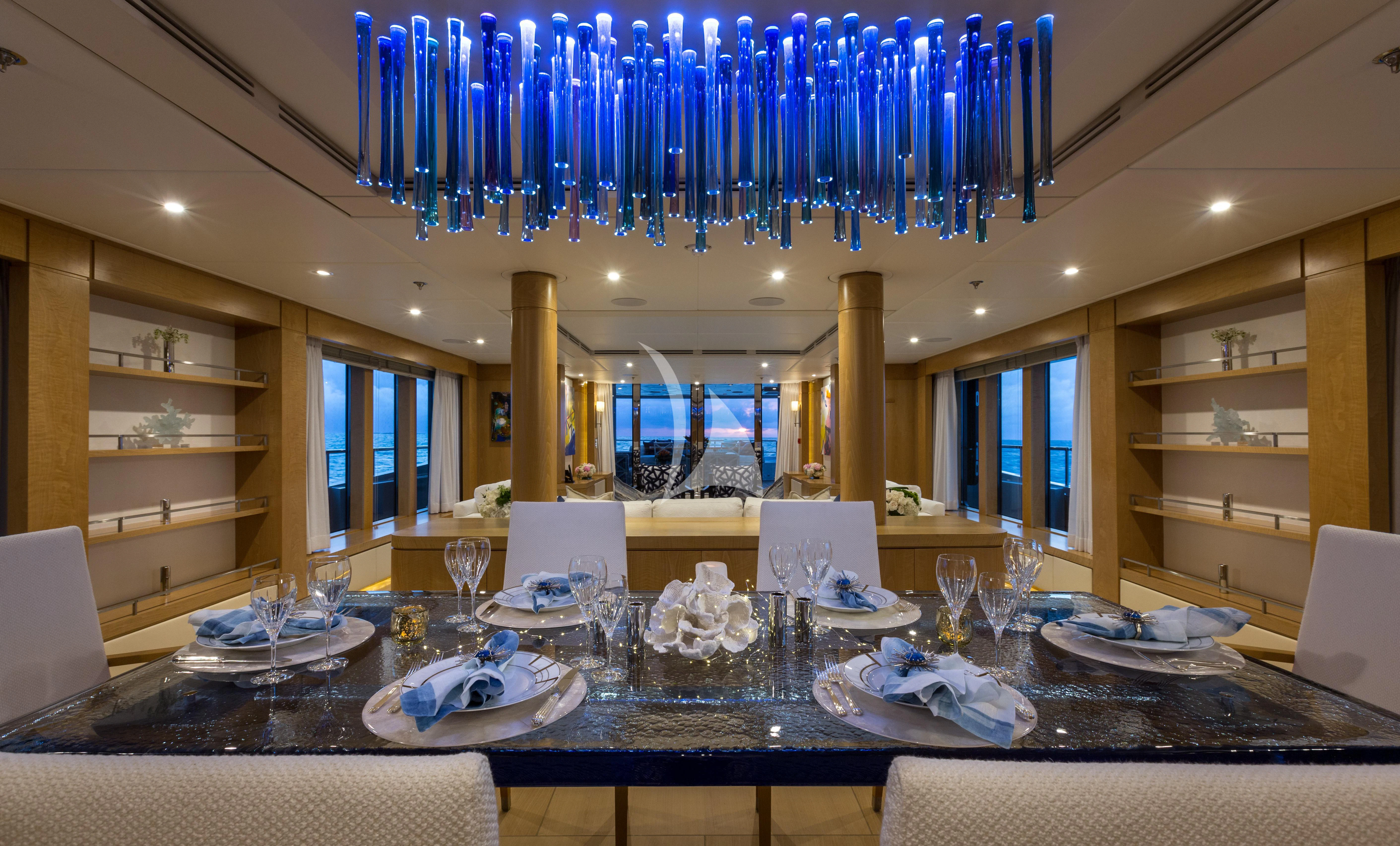 a large kitchen with a large chandelier aboard BACA Yacht for Charter