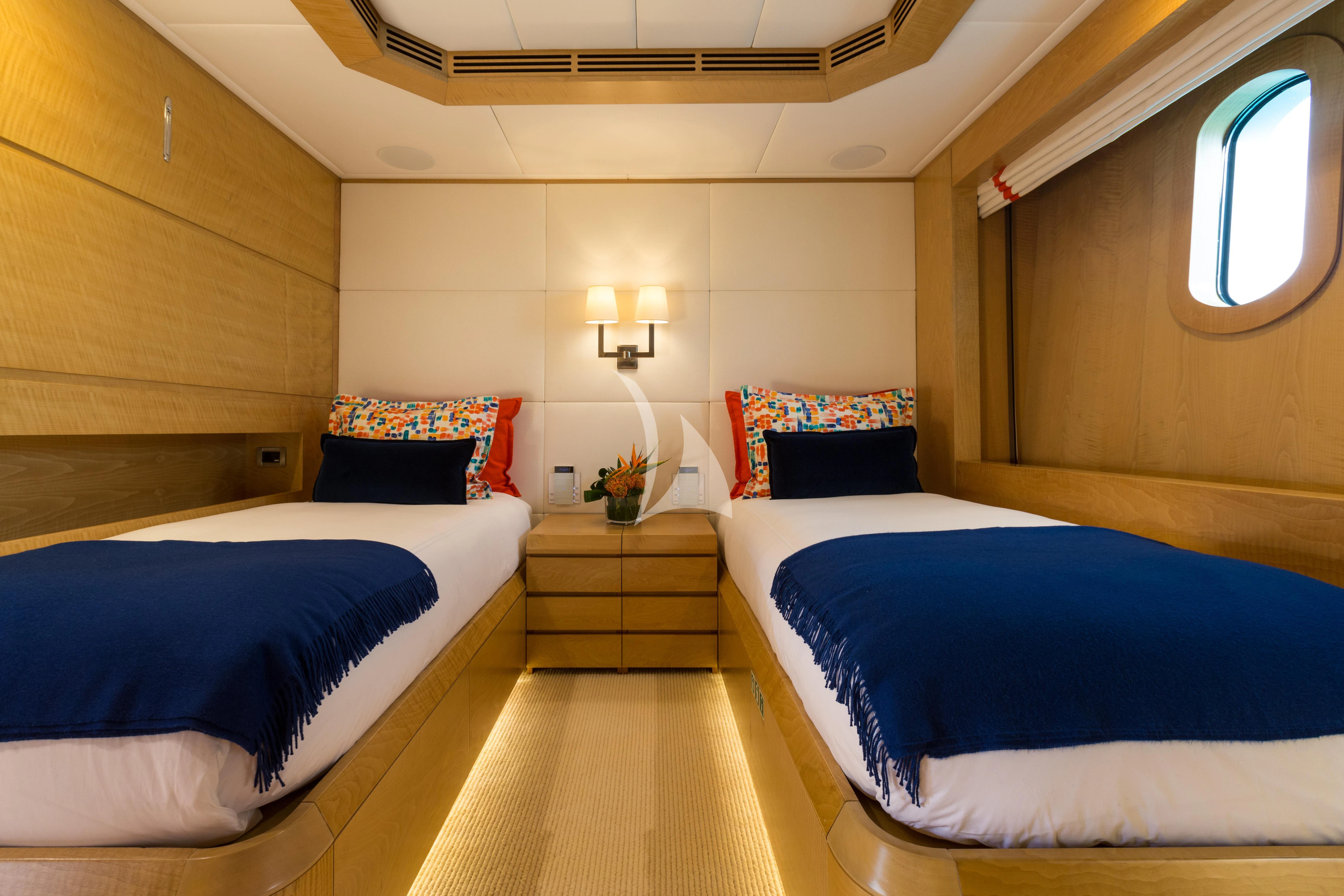 a room with two beds aboard BACA Yacht for Charter