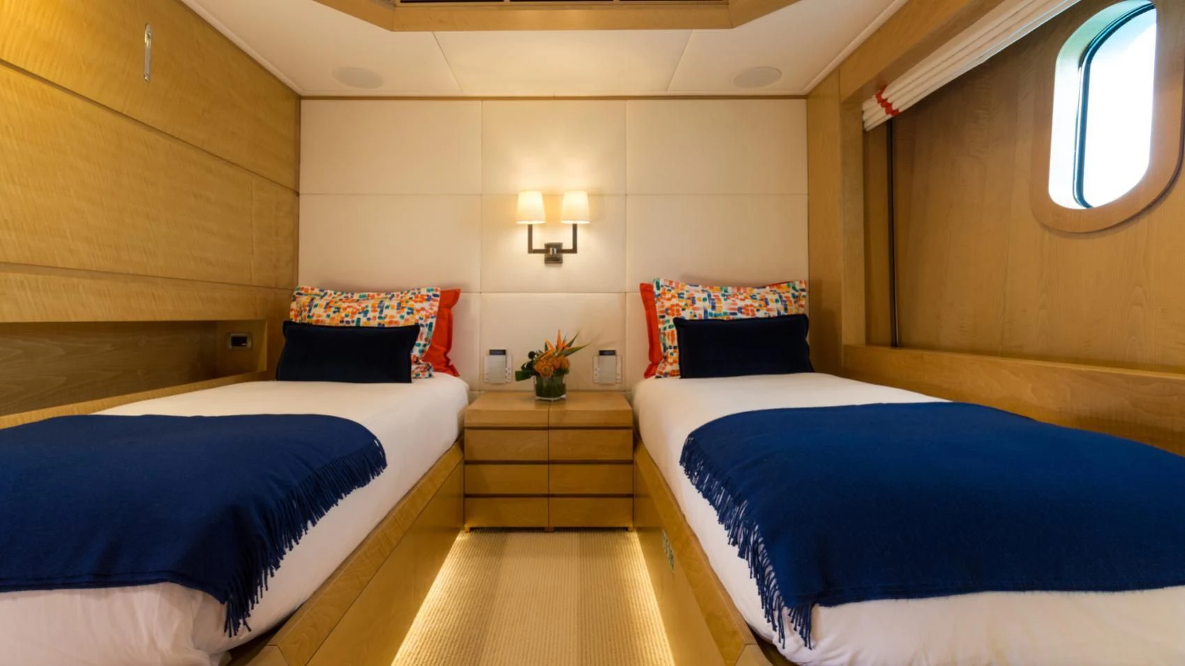 a room with two beds aboard BACA Yacht for Charter