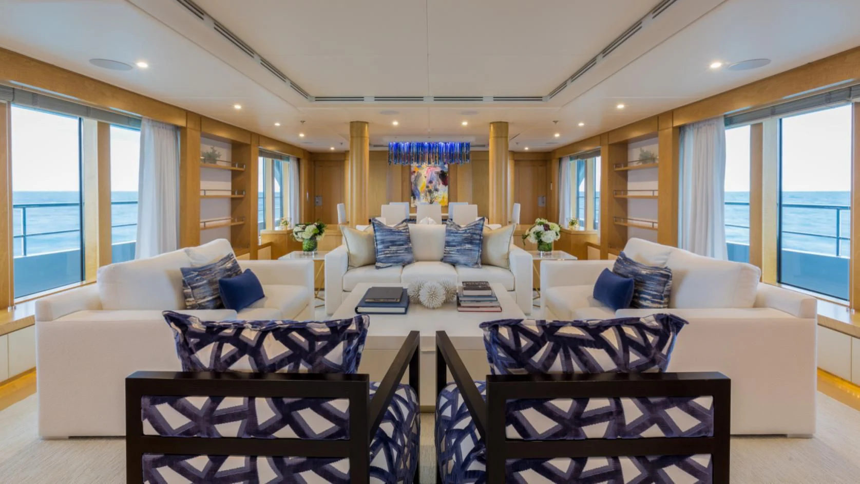 a living room with a couch and a table aboard BACA Yacht for Charter