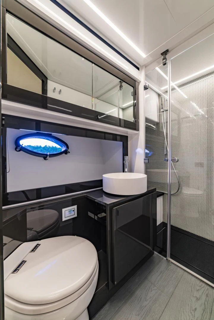 a bathroom with a glass shower aboard BAD DADDY Yacht for Sale