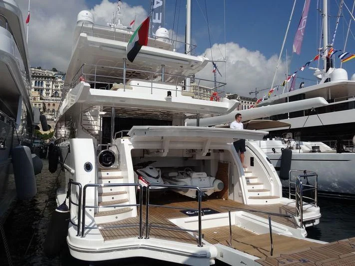 a boat docked with a person standing on the deck aboard AMORE Yacht for Sale