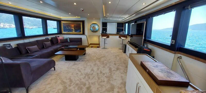 a room with a bed and a desk aboard DEEP WATER Yacht for Charter