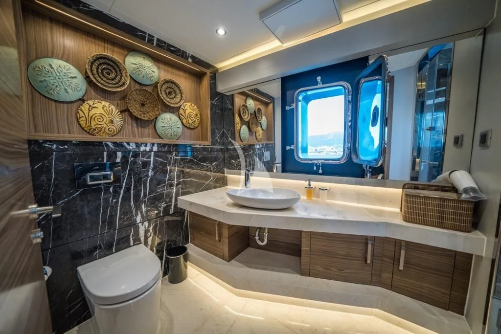 a bathroom with a large mirror aboard DEEP WATER Yacht for Charter