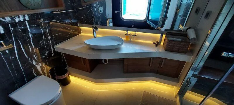 a bathroom with a sink and a toilet aboard DEEP WATER Yacht for Charter