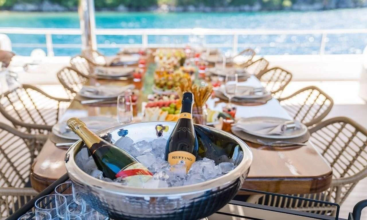 a bucket of paint and brushes on a table aboard DEEP WATER Yacht for Charter
