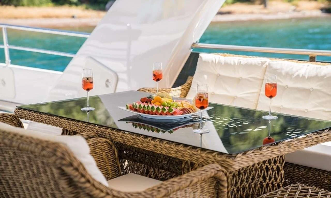a table with food and drinks on it aboard DEEP WATER Yacht for Charter