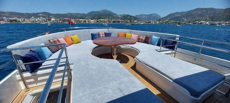 a deck with lounge chairs on it aboard DEEP WATER Yacht for Charter