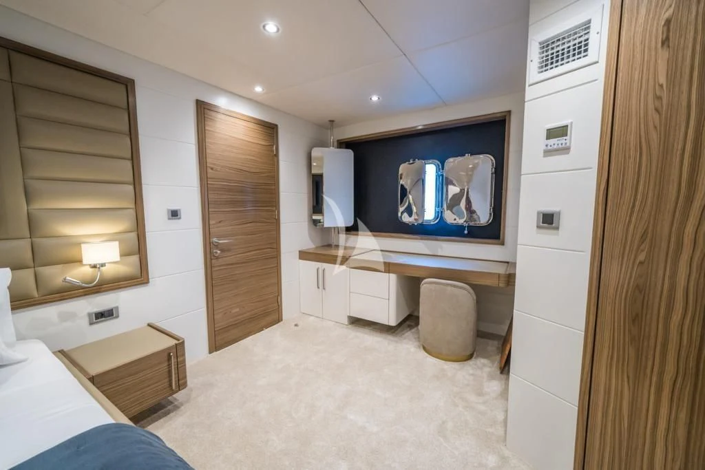 a room with a tv and a bed aboard DEEP WATER Yacht for Charter