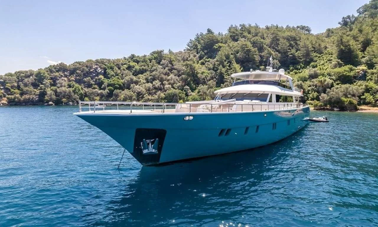 a large white boat on the water aboard DEEP WATER Yacht for Charter