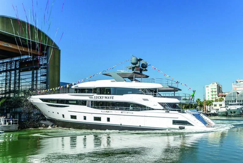 a white boat in a harbor aboard CASA Yacht for Sale