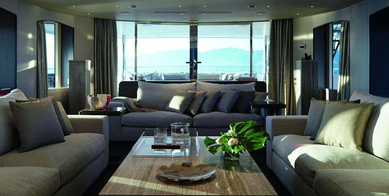 a living room with a large window aboard CASA Yacht for Sale