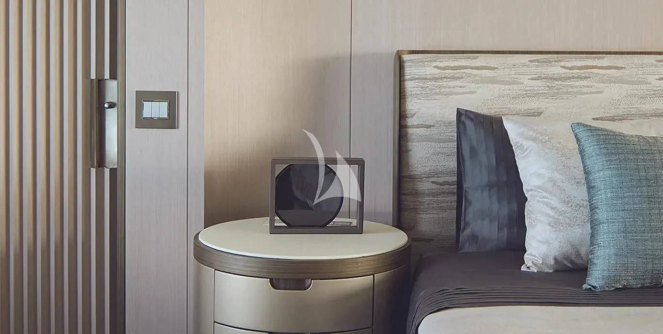 a small white bathroom with a white chair and a white toilet aboard CASA Yacht for Sale