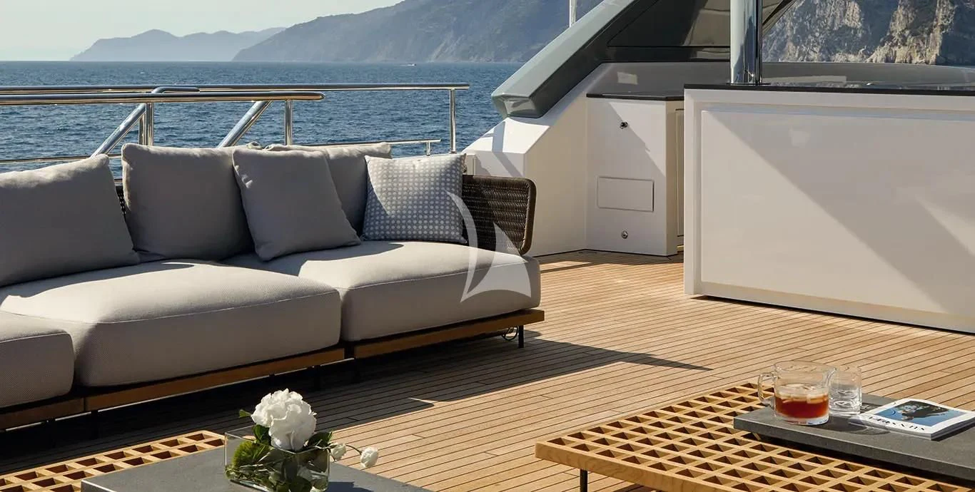 a living room with a couch and a table aboard CASA Yacht for Sale